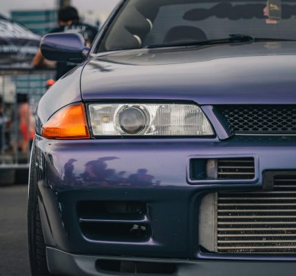 Front view of a purple Nissan Skyline GTR R32 at a car meet in Tampa, Florida.