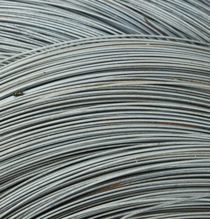 Abstract background of thin fragile white many wires placed chaotically in rows and lines